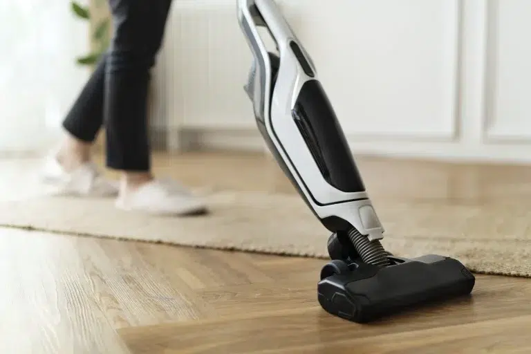 housewife vacuuming parquet floor 1536x1024.jpg
